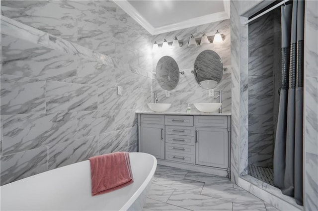 full bath featuring double vanity, a sink, crown molding, tile walls, and marble finish floor