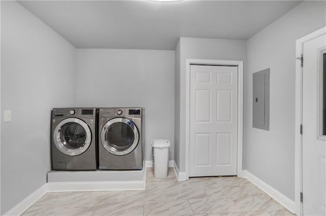 laundry room with baseboards, washer and clothes dryer, electric panel, laundry area, and marble finish floor