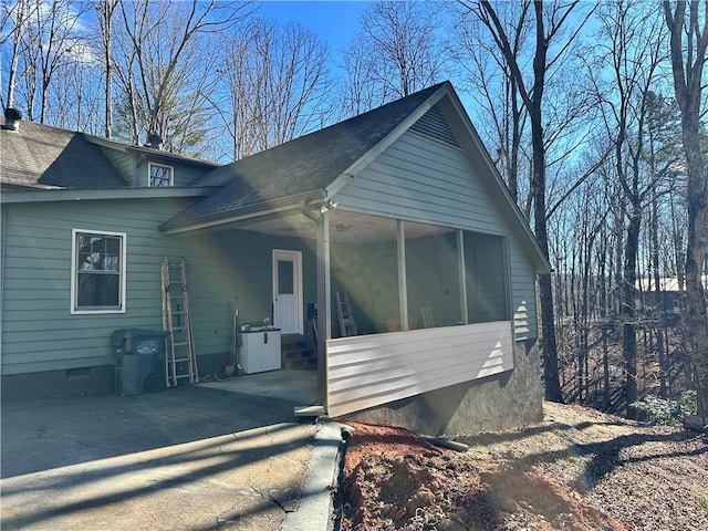 view of side of property with a sunroom and central AC