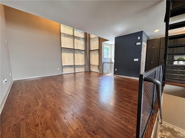 1400 Peter Haughton Way NW, Atlanta, GA 30318 - unfurnished living room featuring wood finished floors and a wall of windows