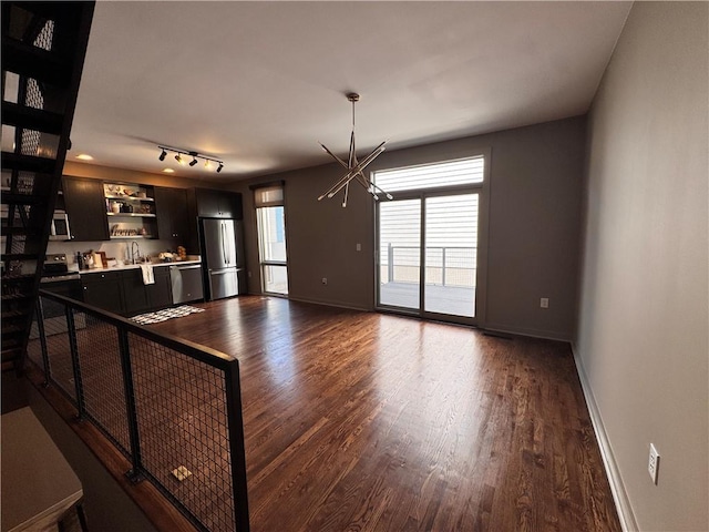 1400 Peter Haughton Way NW, Atlanta, GA 30318 - unfurnished living room featuring a chandelier and dark wood finished floors