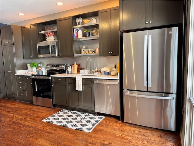 1400 Peter Haughton Way NW, Atlanta, GA 30318 - kitchen featuring stainless steel appliances, open shelves, light countertops, dark wood-type flooring, and recessed lighting