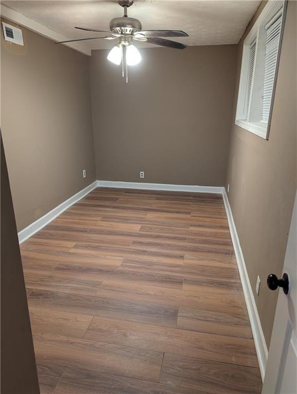 spare room with ceiling fan and hardwood / wood-style floors