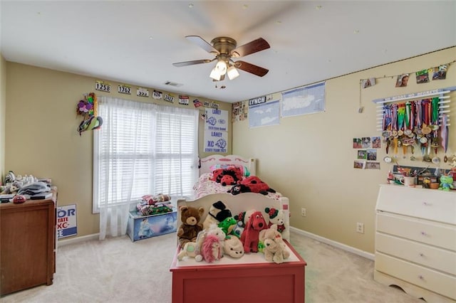 carpeted bedroom with ceiling fan