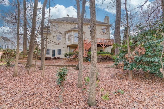 rear view of house with a wooden deck