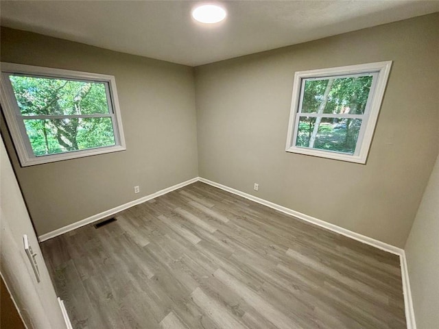 spare room featuring hardwood / wood-style flooring