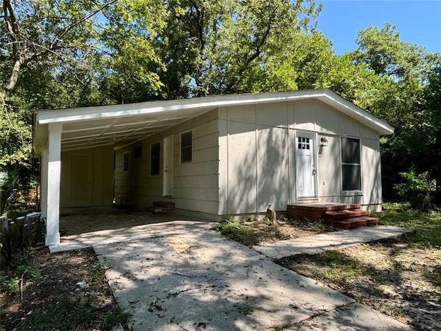 view of outbuilding with a carport