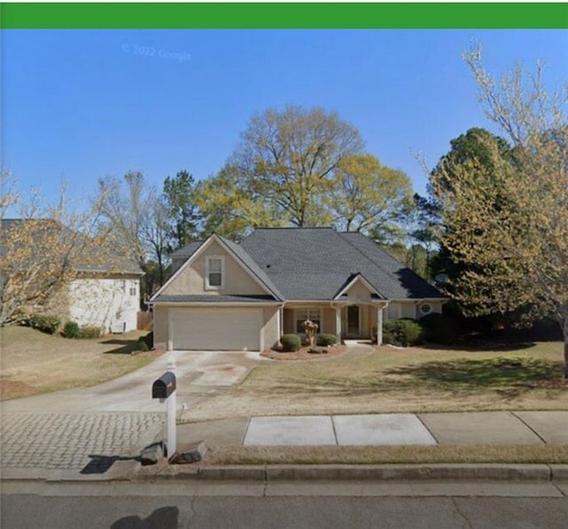 222 Yardsley Dr, Mcdonough, GA 30253 - view of front of house featuring concrete driveway and an attached garage