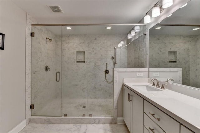 full bath featuring baseboards, marble look tiles, vanity, a shower stall, and recessed lighting