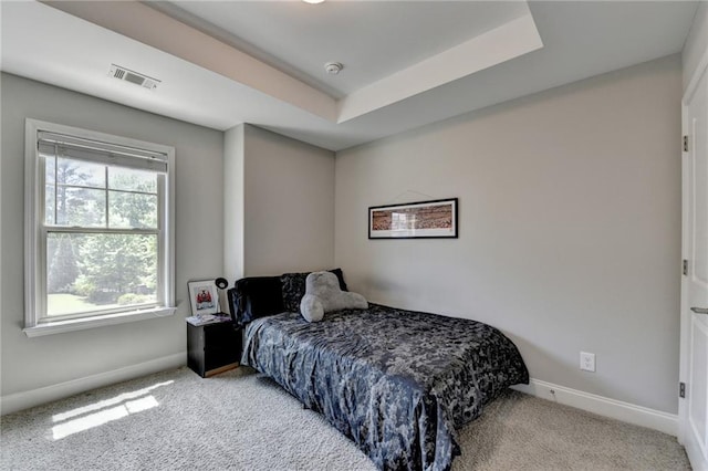 carpeted bedroom featuring baseboards