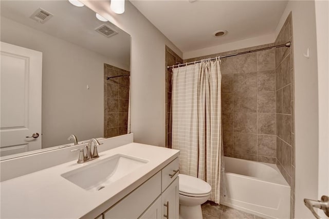 bathroom with toilet, shower / bath combo with shower curtain, vanity, and tile patterned flooring