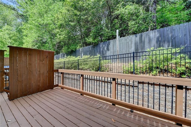 deck with a fenced backyard