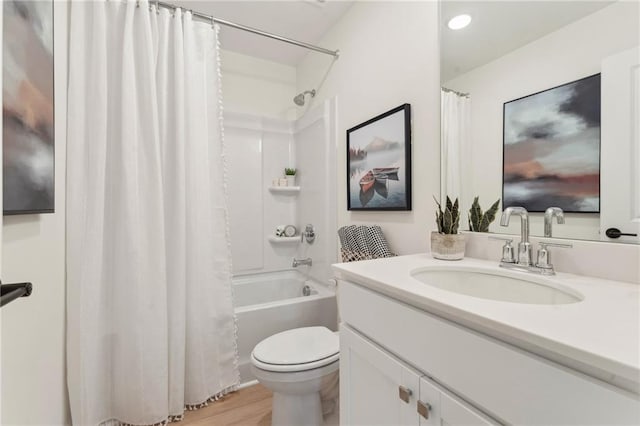 full bathroom featuring vanity, shower / bath combo with shower curtain, toilet, and wood finished floors