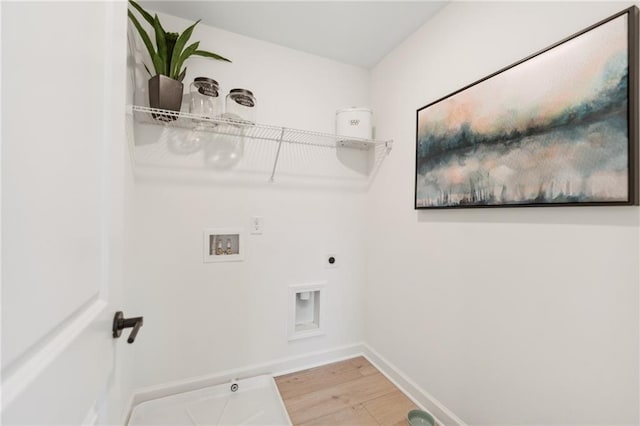 washroom featuring washer hookup, laundry area, electric dryer hookup, wood finished floors, and baseboards