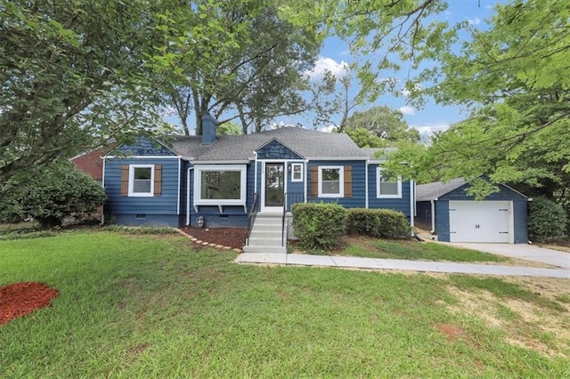 view of front of home with crawl space, a detached garage, an outdoor structure, and a front yard