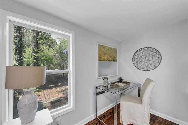 office space featuring baseboards and wood finished floors