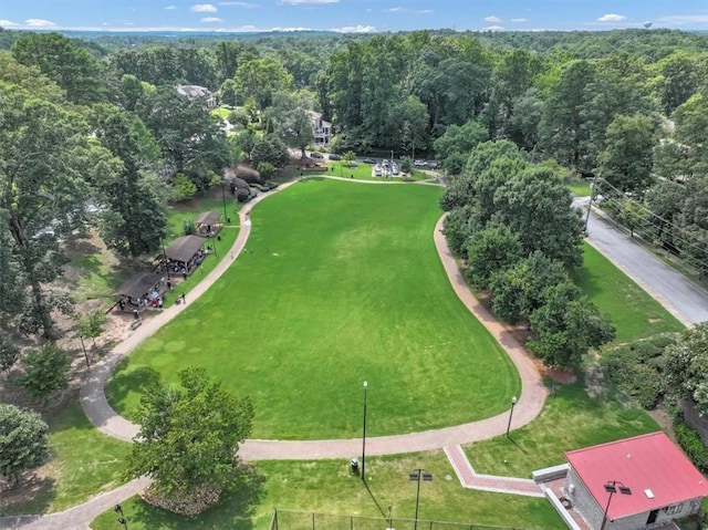 birds eye view of property with a wooded view