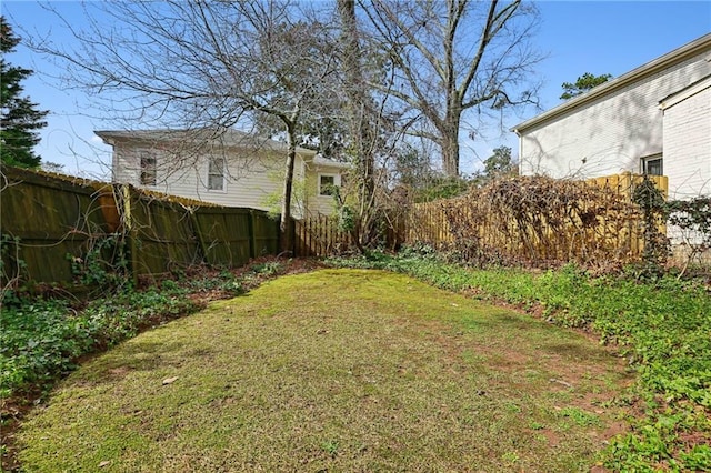 view of yard with a fenced backyard