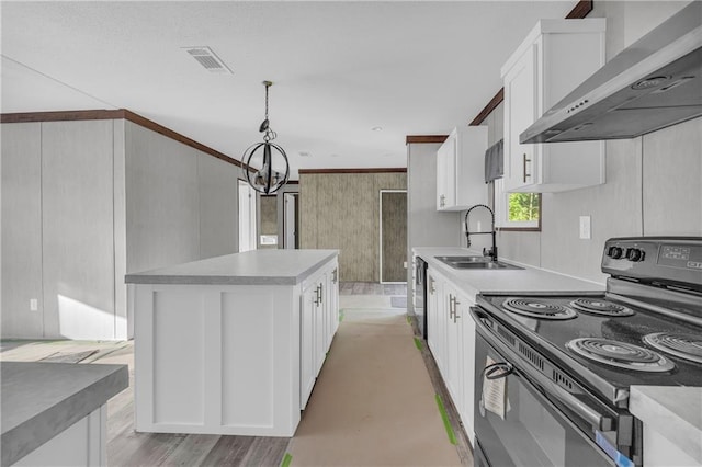 2655 Jess Guest Rd, Dewy Rose, GA 30634 - kitchen with black electric range oven, wall chimney range hood, a chandelier, white cabinets, and a sink