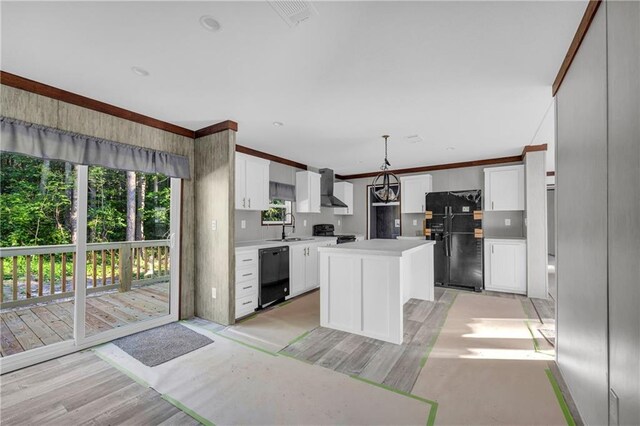 2655 Jess Guest Rd, Dewy Rose, GA 30634 - kitchen with black appliances, a sink, wall chimney range hood, light countertops, and a center island