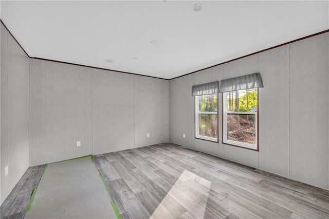 2655 Jess Guest Rd, Dewy Rose, GA 30634 - empty room featuring wood finished floors and a decorative wall