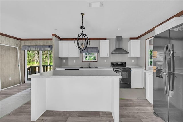 2655 Jess Guest Rd, Dewy Rose, GA 30634 - kitchen with stainless steel refrigerator with ice dispenser, black range with electric cooktop, wall chimney exhaust hood, a sink, and ornamental molding
