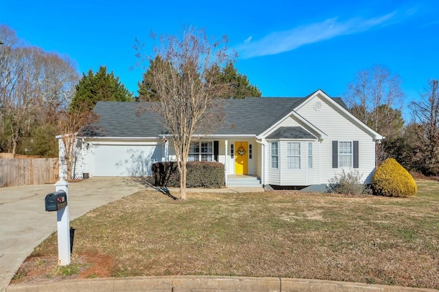 ranch-style home with a garage and a front yard