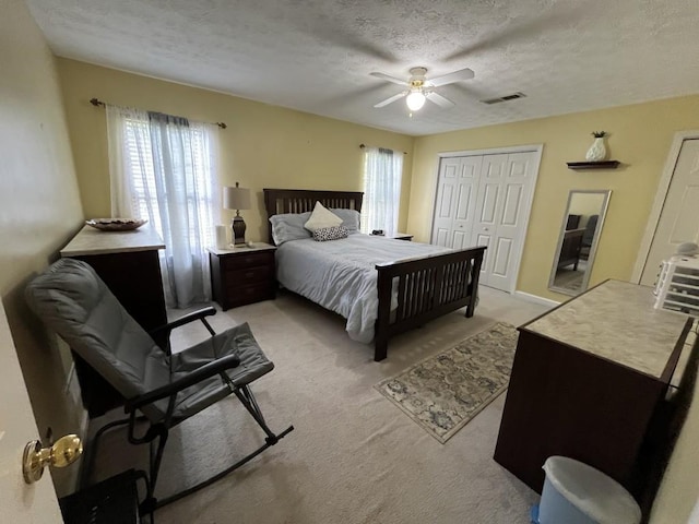 2529 Feathertree Ln, Lawrenceville, GA 30044 - bedroom with multiple windows, a textured ceiling, light colored carpet, and ceiling fan