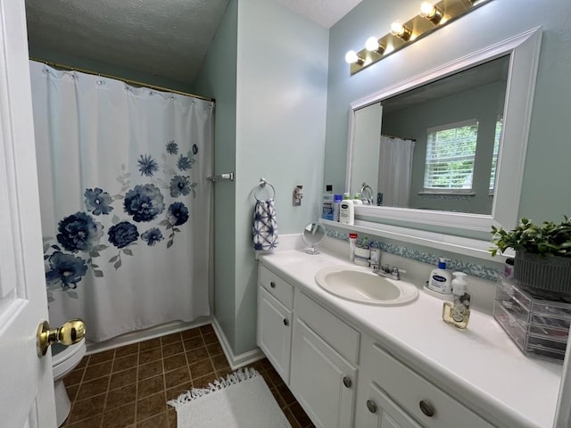 2529 Feathertree Ln, Lawrenceville, GA 30044 - full bath featuring vanity, toilet, a textured ceiling, tile patterned flooring, and curtained shower