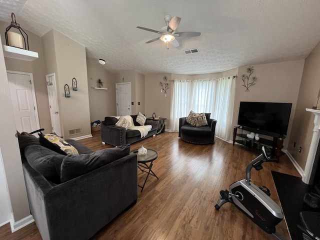 2529 Feathertree Ln, Lawrenceville, GA 30044 - living room featuring ceiling fan, wood finished floors, baseboards, and a textured ceiling