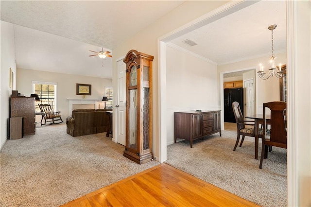 interior space featuring carpet floors and an inviting chandelier