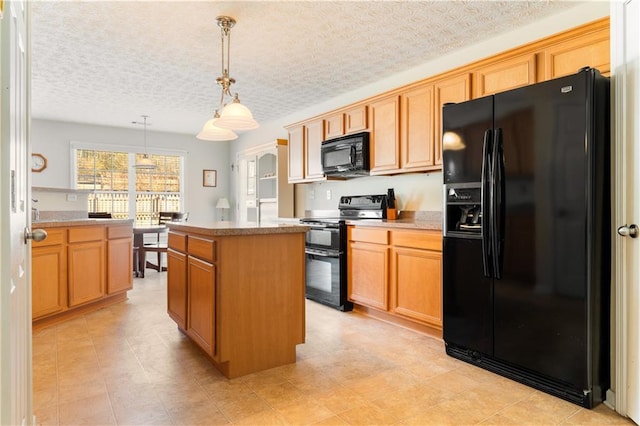 kitchen featuring a center island, pendant lighting, a textured ceiling, and black appliances