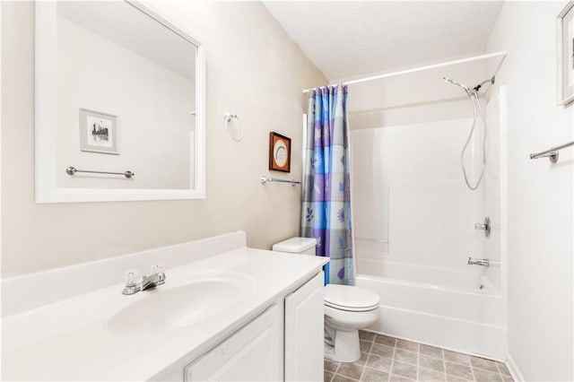 full bathroom with vanity, shower / tub combo with curtain, a textured ceiling, and toilet