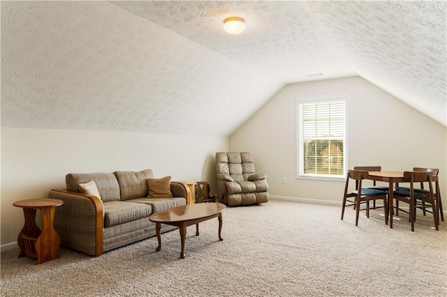 interior space with carpet floors, a textured ceiling, and vaulted ceiling