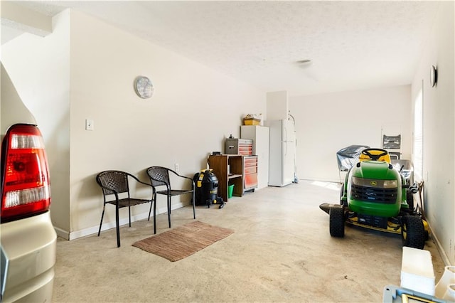 garage with white refrigerator