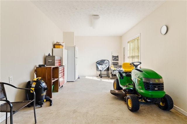 miscellaneous room with a textured ceiling