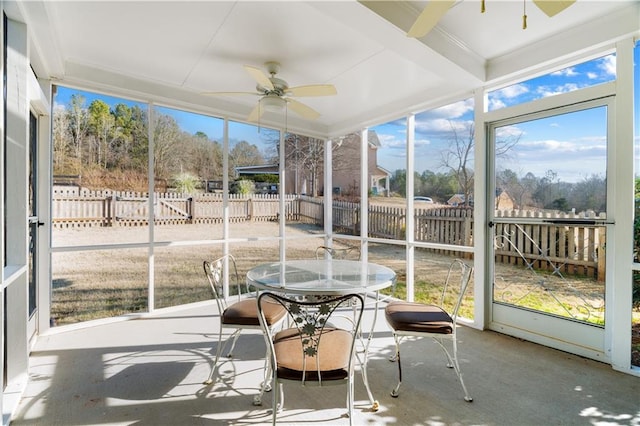 sunroom featuring ceiling fan