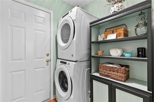 laundry room with stacked washer and clothes dryer