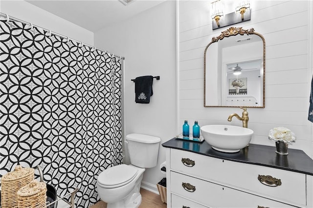 bathroom with vanity, a shower with curtain, and toilet