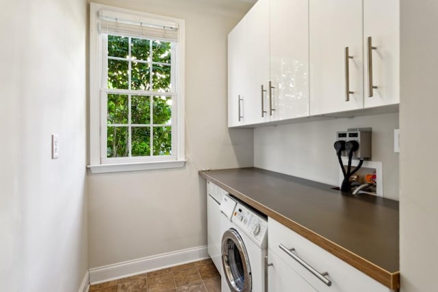 clothes washing area with cabinets and washer / dryer