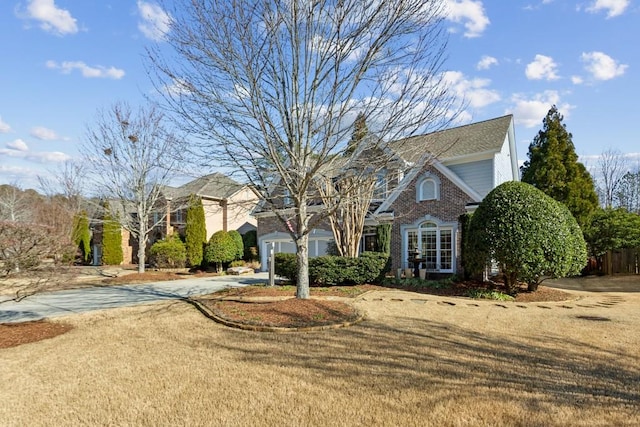 view of property featuring a front lawn