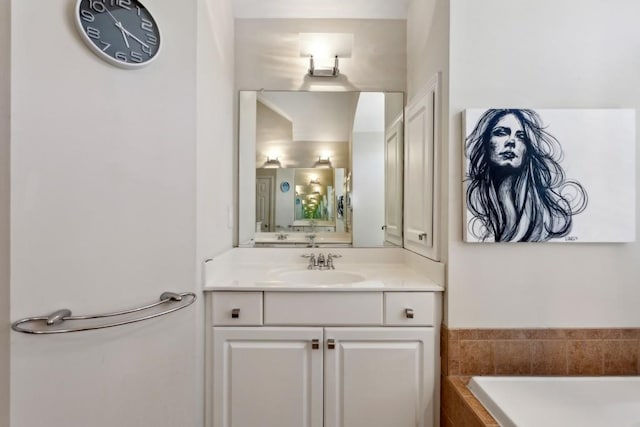 bathroom with vanity and a bath