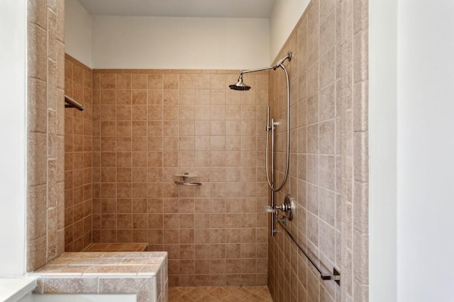 bathroom featuring tiled shower