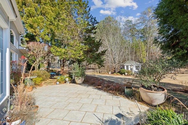 view of patio with an outdoor structure