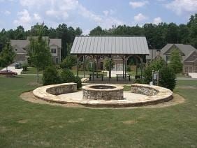 surrounding community featuring a yard, a gazebo, and an outdoor fire pit