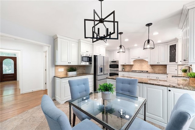 4429 Windsor Oaks Cir, Marietta, GA 30066 - dining area with recessed lighting and a chandelier