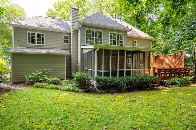 4429 Windsor Oaks Cir, Marietta, GA 30066 - rear view of house featuring a chimney, a sunroom, a yard, and a shingled roof