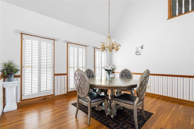 1732 Winding Woods Ln, Jonesboro, GA 30236 - dining space with hardwood / wood-style floors, a chandelier, and high vaulted ceiling