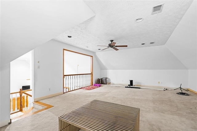 1732 Winding Woods Ln, Jonesboro, GA 30236 - bonus room featuring carpet floors, a textured ceiling, a ceiling fan, and vaulted ceiling