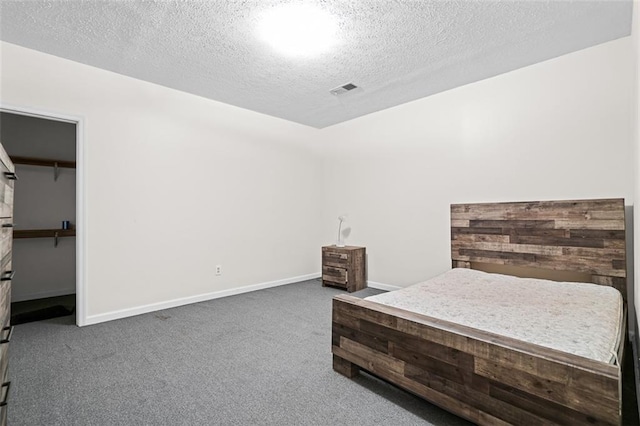 1732 Winding Woods Ln, Jonesboro, GA 30236 - bedroom with carpet floors and a textured ceiling